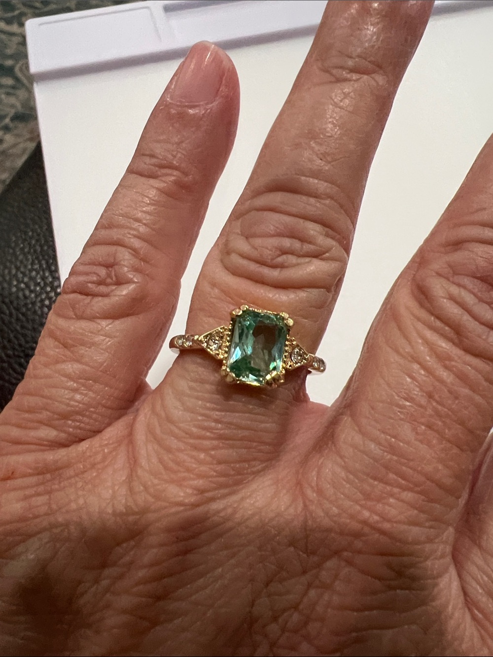 Gold Ring with Green Rectangular Gemstone